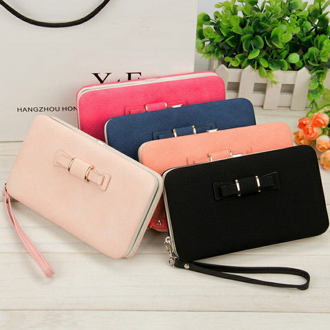 Factory spot low price wholesale new Korean version of women's wallet in the long money bag butterfly knot lunch box woman bag tide