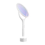 White electric swatter rotated 45 degrees standing in base