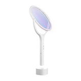 White electric swatter rotated 45 degrees standing in base